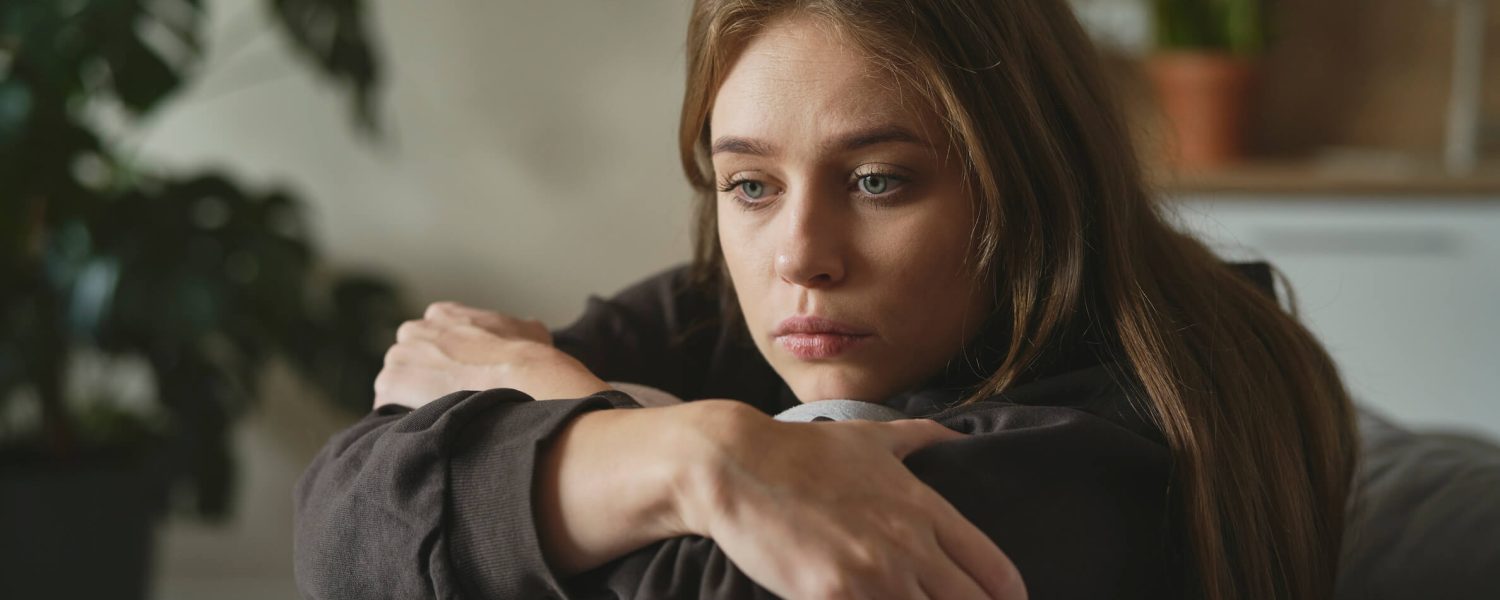 caucasian-sad-woman-sitting-at-the-sofa-with-depre-2022-10-14-19-38-39-utc